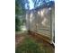 Exterior view of home showing siding detail with view of side yard and lawn at 95 Heartwood Xing, Dallas, GA 30157