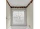 Close up of the soaking tub with a decorative window at 1735 Silver Way, Lithia Springs, GA 30122