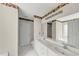Bathroom with double vanity, large mirror, and decorative border at 1735 Silver Way, Lithia Springs, GA 30122