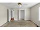 Neutral bedroom features a ceiling fan, closet and views to the hall at 1735 Silver Way, Lithia Springs, GA 30122
