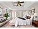 Bright bedroom with white and black decor and ceiling fan at 1735 Silver Way, Lithia Springs, GA 30122