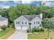 Charming two-story home featuring a well-maintained front yard and a two-car garage at 1735 Silver Way, Lithia Springs, GA 30122