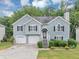 Charming two-story home with a two-car garage and well-manicured lawn and front yard at 1735 Silver Way, Lithia Springs, GA 30122