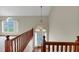 Home's foyer featuring a wooden staircase, high ceilings, and a decorative glass front door at 1735 Silver Way, Lithia Springs, GA 30122