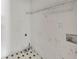 Utility room with checkerboard floor and a wire shelf at 1735 Silver Way, Lithia Springs, GA 30122