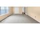 Expansive living room with carpet, window, and french doors at 1735 Silver Way, Lithia Springs, GA 30122