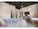 Cozy bedroom features a round window, dresser, and comfortable bedding at 790 North Ne Ave # 209, Atlanta, GA 30306