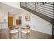 Bright dining area featuring modern glass table, unique chairs and stairway architecture at 790 North Ne Ave # 209, Atlanta, GA 30306