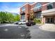 Brick apartment building featuring large arched windows, private balconies, and convenient parking at 790 North Ne Ave # 209, Atlanta, GA 30306