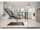 Modern kitchen featuring stainless steel appliances, bright lighting, and view into the living area at 790 North Ne Ave # 209, Atlanta, GA 30306