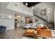 Open-concept living space featuring high ceilings, modern lighting, and a sleek kitchen area at 790 North Ne Ave # 209, Atlanta, GA 30306