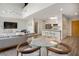 Open-concept living space with modern furniture, a sleek kitchen, and stylish light fixtures at 790 North Ne Ave # 209, Atlanta, GA 30306