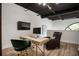 Modern office features a sleek desk, stylish chairs, and a striking exposed ceiling at 790 North Ne Ave # 209, Atlanta, GA 30306