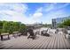 Relaxing outdoor deck with lounge chairs and scenic views of the city skyline on a sunny day at 790 North Ne Ave # 209, Atlanta, GA 30306