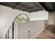 Bright stairwell with a unique arched window and industrial exposed ceiling at 790 North Ne Ave # 209, Atlanta, GA 30306