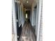 Bright foyer showcasing beautiful hardwood floors with views to a window at the end of the hall at 1601 Dosk Ave, Lawrenceville, GA 30044