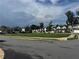 Neighborhood street view of a modern community with green common area at 1601 Dosk Ave, Lawrenceville, GA 30044