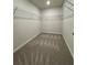 Large walk-in closet with shelving and carpet flooring at 1601 Dosk Ave, Lawrenceville, GA 30044