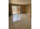 Open living room featuring tile flooring, sliding glass door and neutral paint at 1867 Myrtle Dr # 5, Atlanta, GA 30311