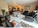 Open-concept living room with tile flooring, comfortable seating, and views into kitchen at 1867 Myrtle Dr # 5, Atlanta, GA 30311
