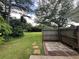 Spacious backyard with a well-maintained lawn, lush landscaping, and a stone paver path at 333 Etoawha Vly, Woodstock, GA 30189