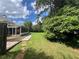 Expansive backyard featuring a screened-in porch and well-manicured lawn at 333 Etoawha Vly, Woodstock, GA 30189