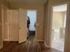 Spacious bedroom leading to an organized closet and bathroom with wood-look flooring at 333 Etoawha Vly, Woodstock, GA 30189