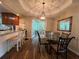 Sunlit breakfast nook featuring granite countertops, stylish chairs, and access to a sunroom, perfect for casual dining at 333 Etoawha Vly, Woodstock, GA 30189