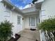 Inviting front entrance featuring a classic door, well-maintained landscaping, and architectural details at 333 Etoawha Vly, Woodstock, GA 30189