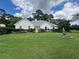 Charming stucco home featuring a lush green lawn and manicured landscaping at 333 Etoawha Vly, Woodstock, GA 30189