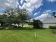 Lush front yard with mature trees, providing shade and enhancing the property's curb appeal in a serene neighborhood at 333 Etoawha Vly, Woodstock, GA 30189