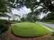 Lush front yard with mature trees, enhancing curb appeal and offering a tranquil outdoor space at 333 Etoawha Vly, Woodstock, GA 30189