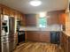 A well-equipped kitchen featuring stainless steel appliances and granite countertops at 333 Etoawha Vly, Woodstock, GA 30189