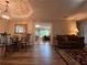 Cozy living room with hardwood floors, open to dining area and office space with lots of natural light at 333 Etoawha Vly, Woodstock, GA 30189
