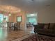Cozy living area with hardwood floors, chandelier, and a view of the dining room, creating an inviting space at 333 Etoawha Vly, Woodstock, GA 30189