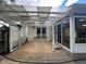 Covered patio offers an outdoor space and views of the sunroom and backyard at 333 Etoawha Vly, Woodstock, GA 30189