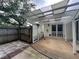 Covered back patio featuring an outdoor seating area, lattice privacy screen and fenced yard at 333 Etoawha Vly, Woodstock, GA 30189