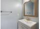Bathroom with neutral paint, decorative mirror, and vanity with white basin sink at 3737 Town Square Nw Cir # 6, Kennesaw, GA 30144