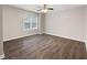 Bedroom features light neutral walls, hardwood floors, and a window at 3737 Town Square Nw Cir # 6, Kennesaw, GA 30144