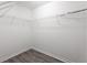 Walk-in closet featuring wire racks and laminate flooring at 3737 Town Square Nw Cir # 6, Kennesaw, GA 30144