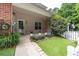Charming front entrance with lovely landscaping, brick accents, and a cozy covered porch at 3737 Town Square Nw Cir # 6, Kennesaw, GA 30144