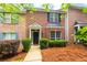 Charming brick townhome with black shutters and a well-maintained front yard at 3737 Town Square Nw Cir # 6, Kennesaw, GA 30144