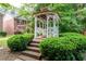 Backyard gazebo featuring steps, benches, and surrounding landscaping for outdoor relaxation at 3737 Town Square Nw Cir # 6, Kennesaw, GA 30144