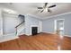 Spacious living room with hardwood floors, a fireplace, and staircase at 3737 Town Square Nw Cir # 6, Kennesaw, GA 30144