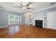 Inviting living room showcasing hardwood floors, a fireplace, and ample natural light at 3737 Town Square Nw Cir # 6, Kennesaw, GA 30144