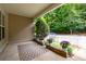 Covered porch decorated with potted purple flowers and a white picket fence at 3737 Town Square Nw Cir # 6, Kennesaw, GA 30144