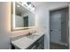 Modern bathroom with illuminated mirror and stylish vanity at 5961 John St, Austell, GA 30106
