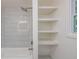 Bathroom features a tub and shower combo with built in shelves at 5961 John St, Austell, GA 30106