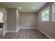 Cozy bedroom featuring hardwood floors, natural light, and neutral paint at 5961 John St, Austell, GA 30106