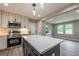 Stylish kitchen with quartz counters, island, and stainless steel appliances at 5961 John St, Austell, GA 30106
